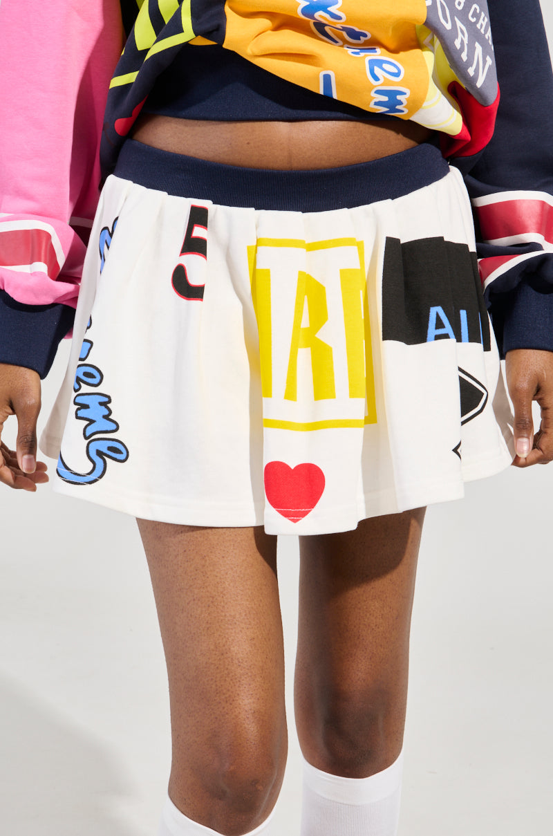 WE ARE INFINITE PLEATED MINI SKIRT