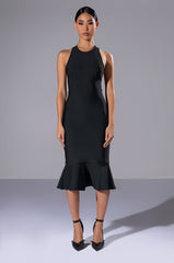 HEIRESS SLEEVELESS PEPLUM DRESS IN BLACK