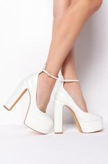PATENT WHITE CHUNKY PUMPS