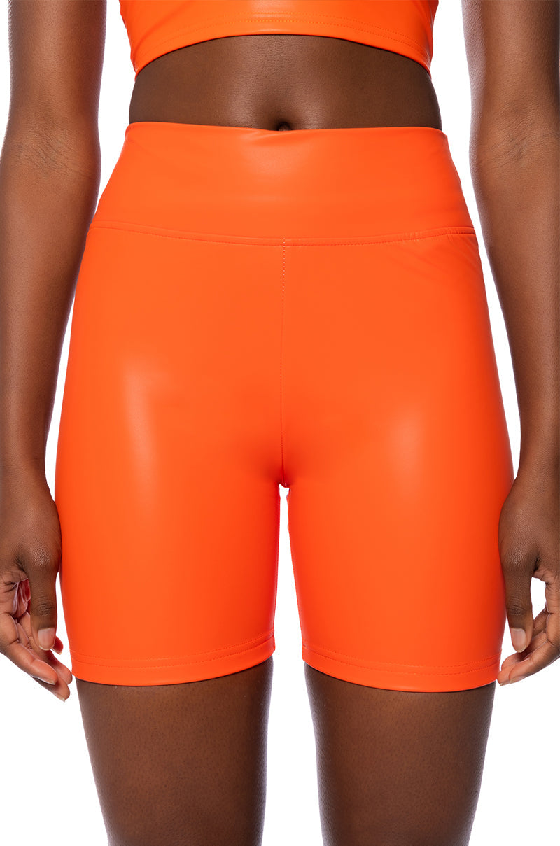 RIO FAUX LEATHER BIKER SHORT IN ORANGE
